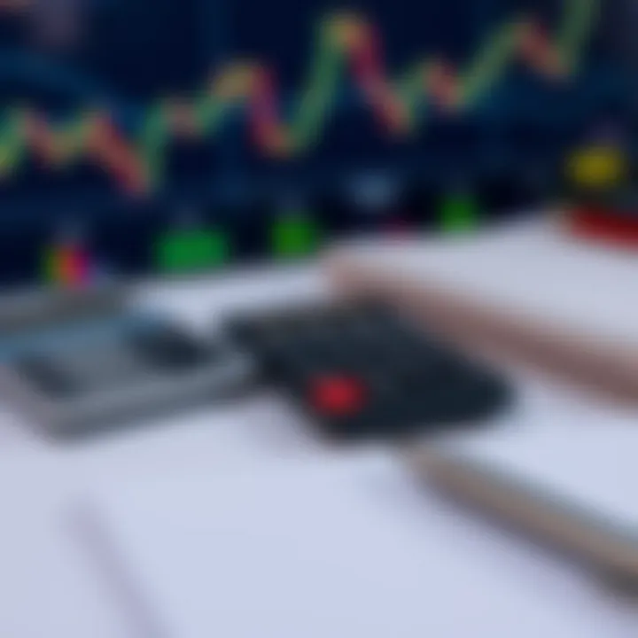 Close-up of a forex trading chart with a calculator, notebook, and pen on a trading desk